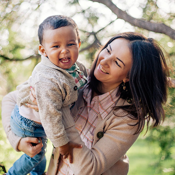 Mother with young son outdoors